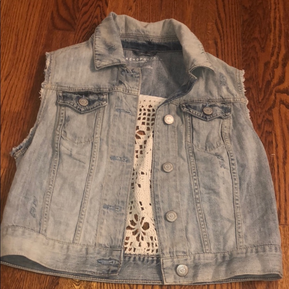 Washed Jean Jacket with a White Crochet Patch